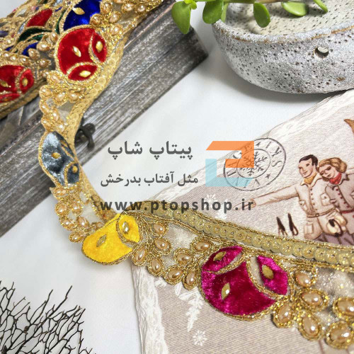 یراق لباس پولک،مروارید و نگین دوزی و تیکه کاری مخمل روی تور ارگانزا